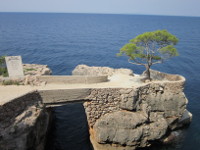 A beautiful small stone bridge, private property, connecting two natural rocks. 