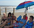 Relaxing at the beach under umbrellas