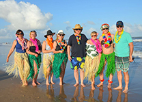 Surfside beach: photo of croatians in Hawaiian ornaments