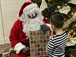Santa giving gifts to children