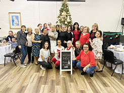 Croatian Ladies posing in front of the Christmas tree